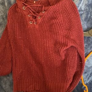 Lightly used sweater with a hood.